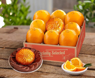 Sweet Navel Oranges surrounding a citrus infused chocolate orange.