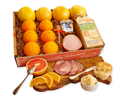 Brunch combo of oranges, grapefruit, bicuit mix, honey and bacon.